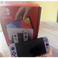 Brand New Oled With 2 Games