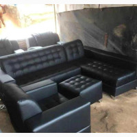 A Seven Seater Of Leather Sofa, With Center Table