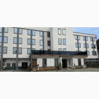 A 4 Story Building Hotel With Rooftop