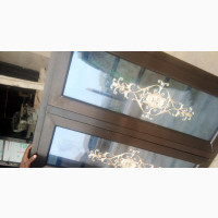 Reflective Glass With Flowers. Casement Windows