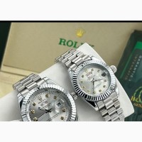 Silver Rolex Couple